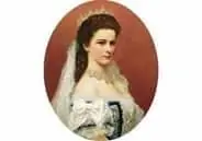 赤茶色の楕円形の背景に、黒髪でピンで留めた髪、レースのディテールが施された白いドレスとヴェールをまとった女性の肖像画。穏やかで荘厳な表情をしている。